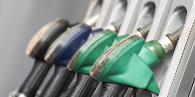 Gas nozzles at the gas station. Shallow depth of field with focus on the first nozzle.